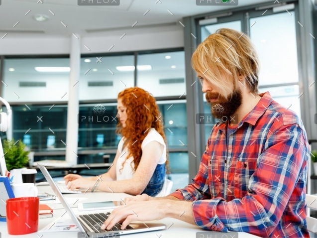 demo-attachment-409-two-co-workers-working-together-PPVW2LA